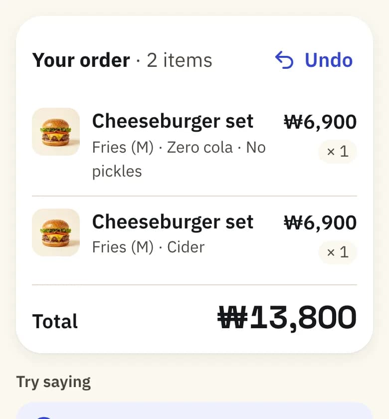 Phone with two cheeseburger sets in the order and the total